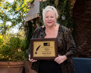 Melanie Maxwell with 1st Place award for Entertainment Reporting